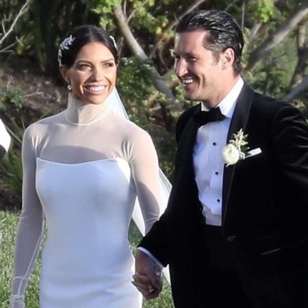 Jenna Johnson and her husband Val Chmerkovskiy pose for a picture in their wedding.